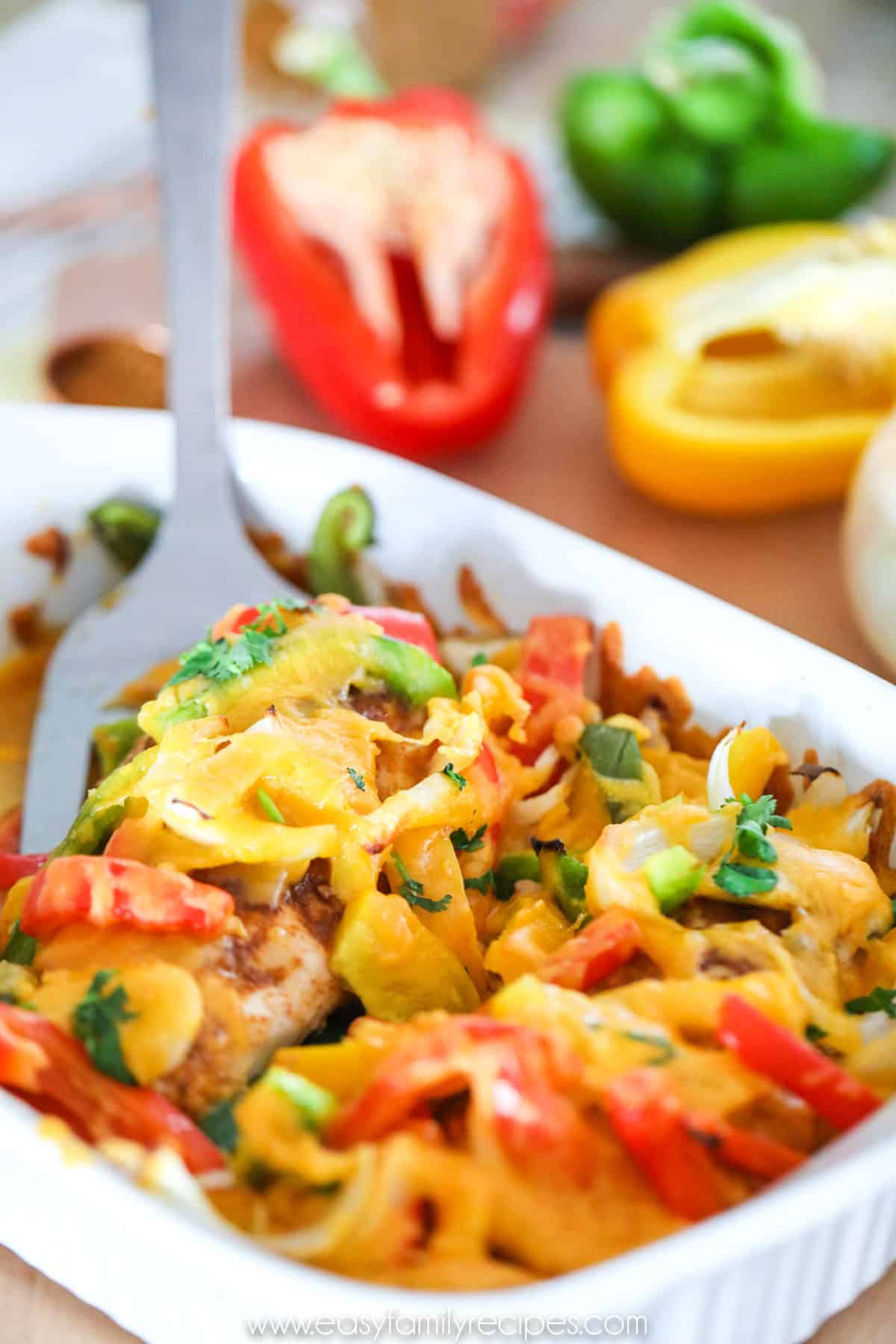 Quick Chicken Fajitas made in oven and topped with cheese and cilantro.
