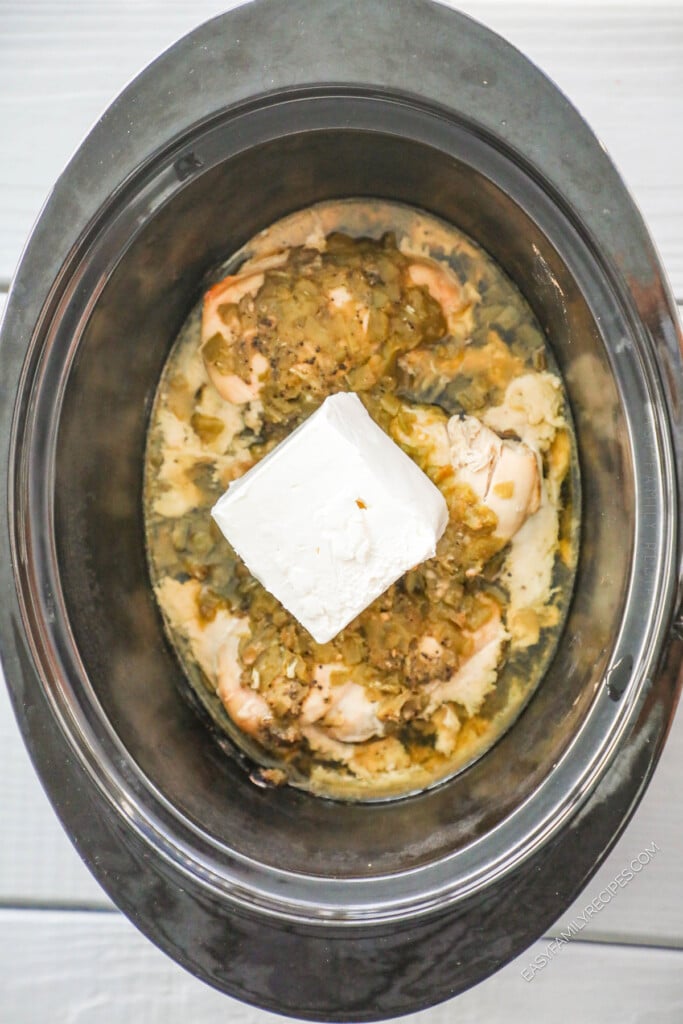 How to Make Green Chile Chicken in Crockpot Step 3: Cook, then add cream cheese.