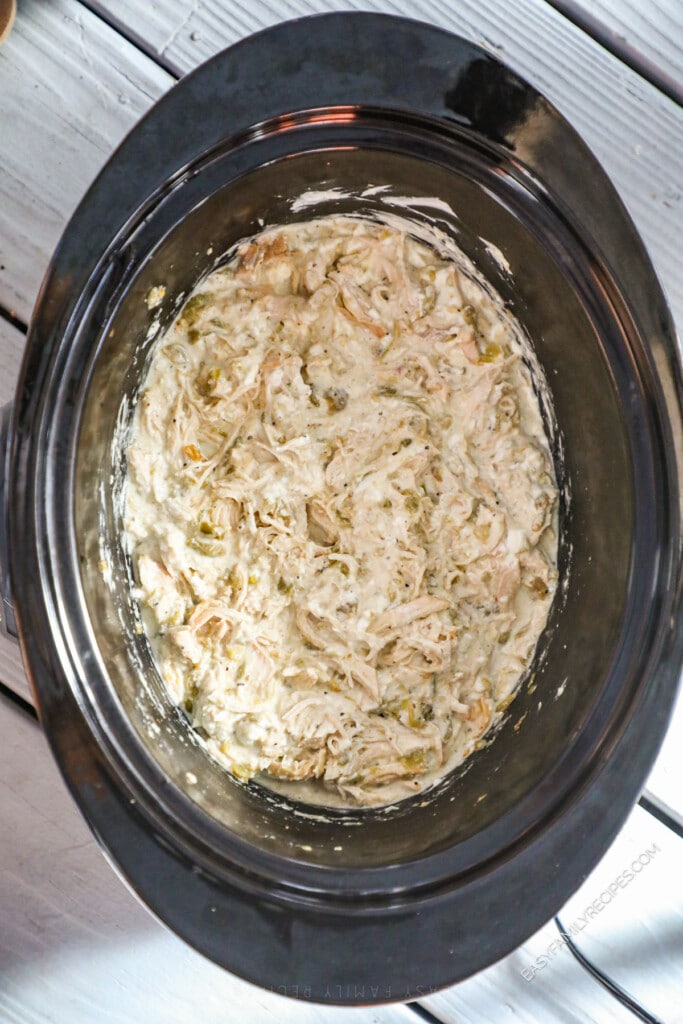 How to Make Green Chile Chicken in Crockpot Step 4: Shred chicken and stir into juices.