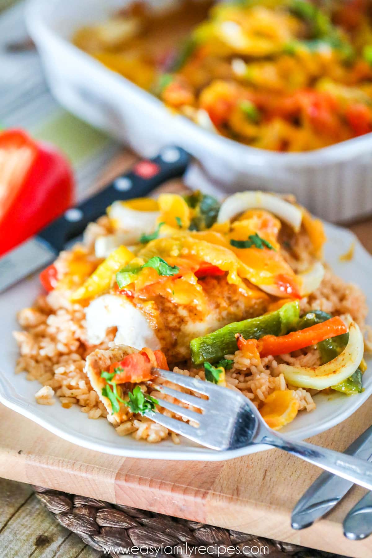 Baked Chicken Fajitas served on a plate with rice.