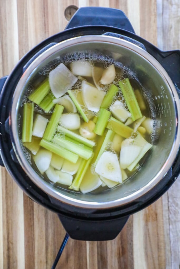 How to Make Turkey Breast in the pressure cooker step 2: Add chicken broth to the slow cooker.