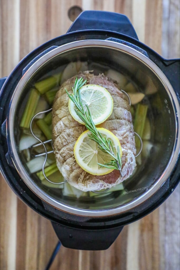 How to Make Turkey Breast in the pressure cooker step 3: Season the turkey breast and place on top of the rack in the slow cooker.