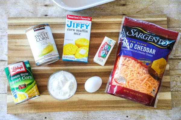 Jiffy Corn Casserole Ingredients including Jiffy cornbread mix, whole kernel corn (canned corn), cream corn, egg, cheese, sour cream, butter