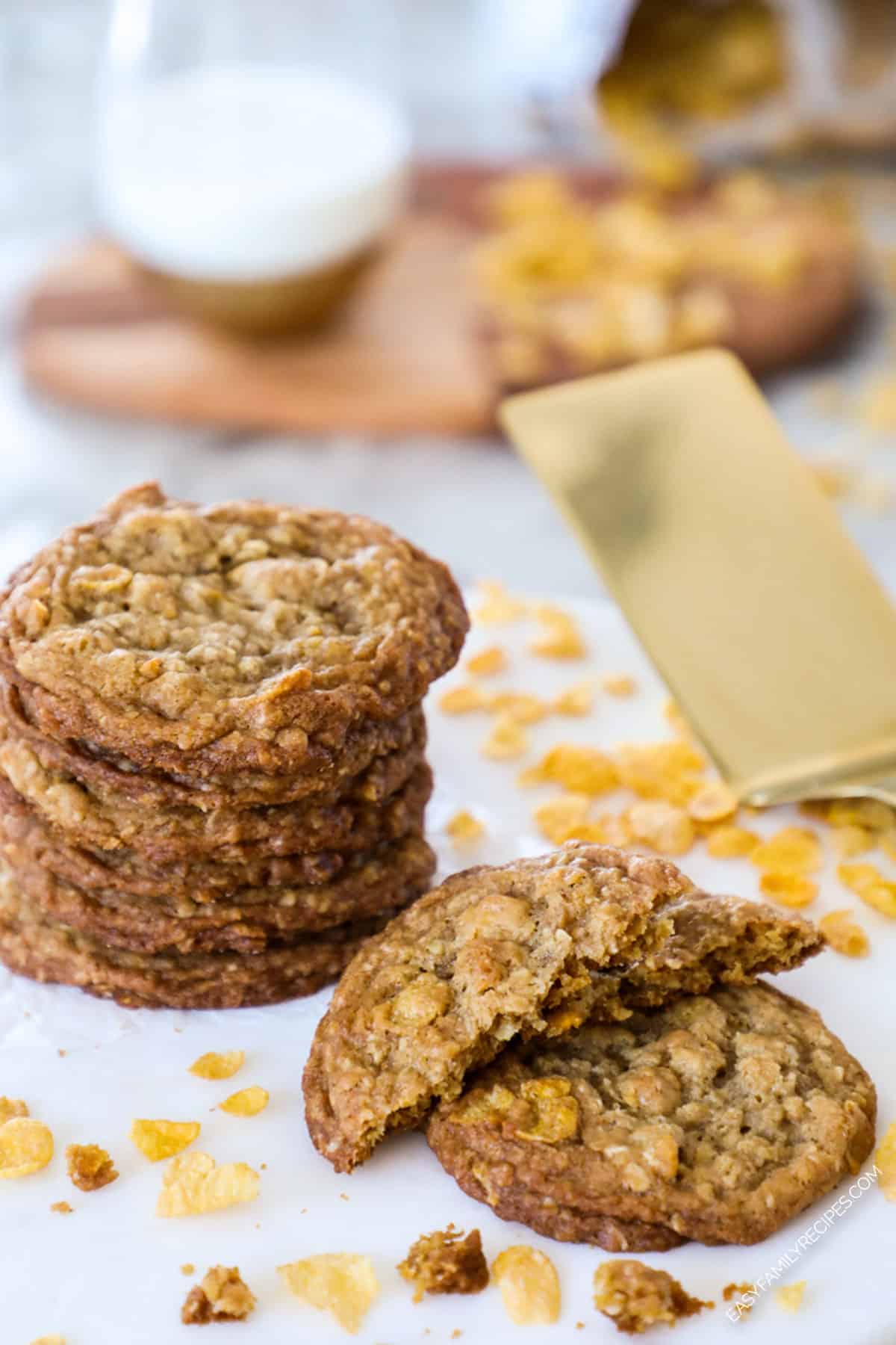 A Pile of ranger cookies with cornflakes behind a broken cookie