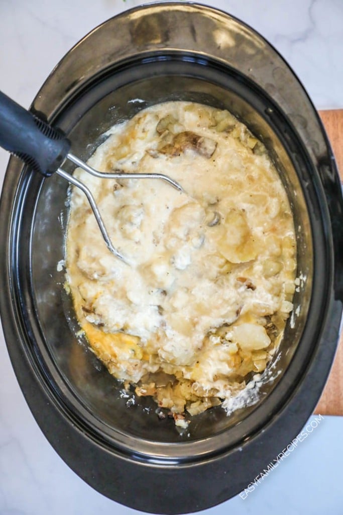 How to make crockpot baked potato soup step 3: Once cooked, mash potatoes until you reach your desired consistency.
