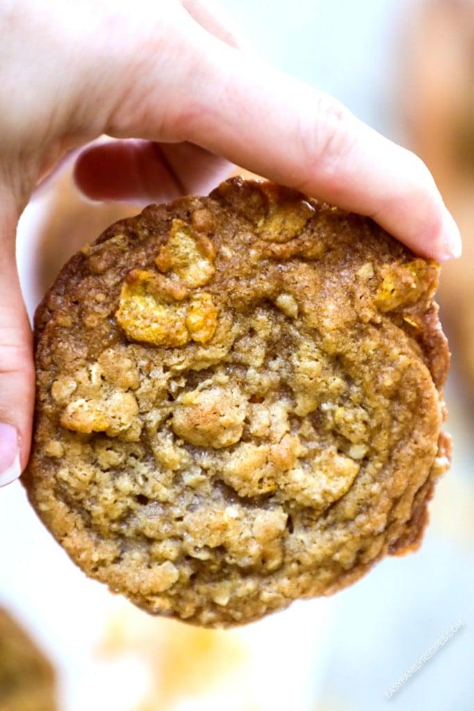 Hand holding a ranger cookie with cornflakes