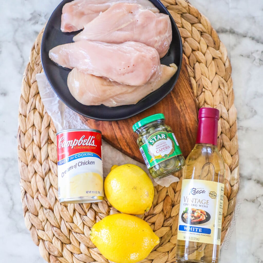 Ingredients for making Chicken Piccata Casserole with chicken breast, lemon and cream of chicken soup.