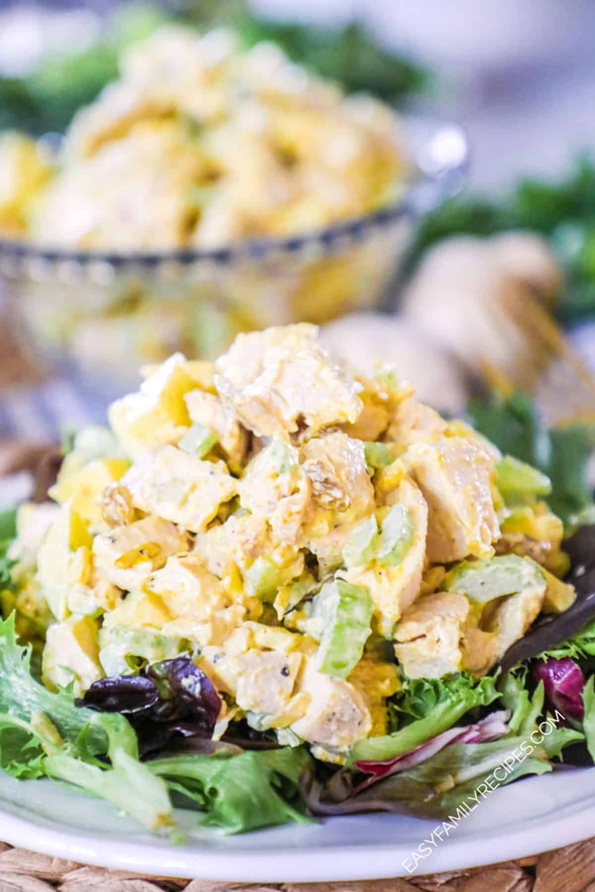 Curry chicken salad served on top of salad greens for lunch.