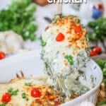Cheesy Spinach Feta Chicken Breast being lifted from baking dish to serve for an easy dinner.