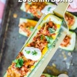 Serving Taco Zucchini Boats garnished with cilantro.