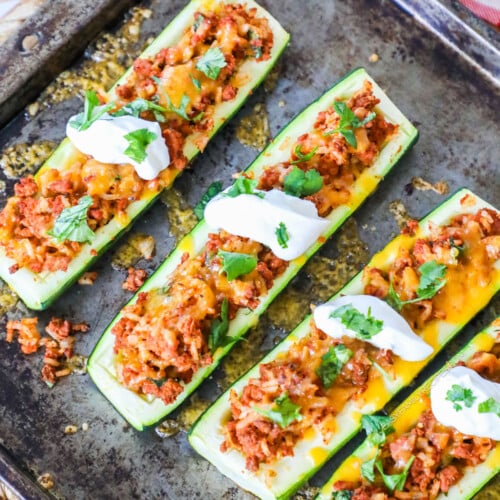 Taco zucchini boats on a sheet pan.