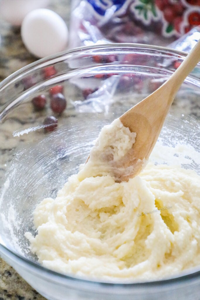 How to make Cranberry Cake step 4: Cream the wet ingredients for the cake together.