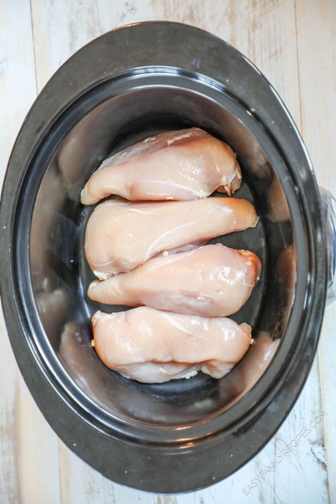 Process photos for how to make slow cooker ranch chicken step 1: place chicken breast or chicken thighs in a crockpot