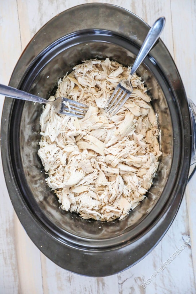 Process photos for how to make slow cooker ranch chicken step 4: Shred the chicken in the and and mix into juices
