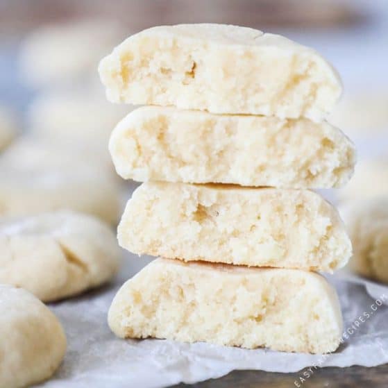 Soft Sugar Cookies are thick and chewy. Broken in half and stacked you can tell how soft and delicious they are!