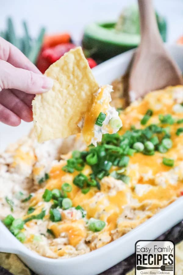 Chip dipped in cajun chicken dip