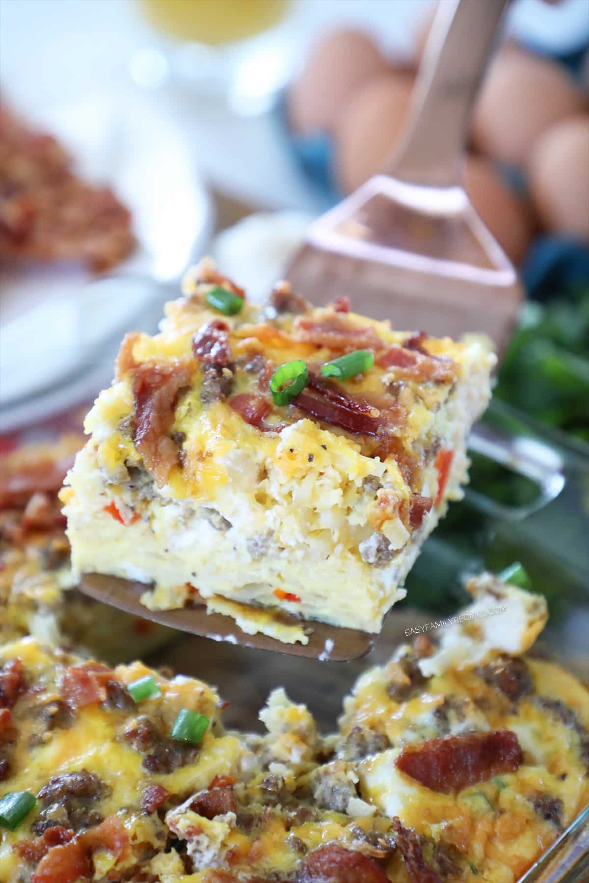 A slice of breakfast casserole on a spatula