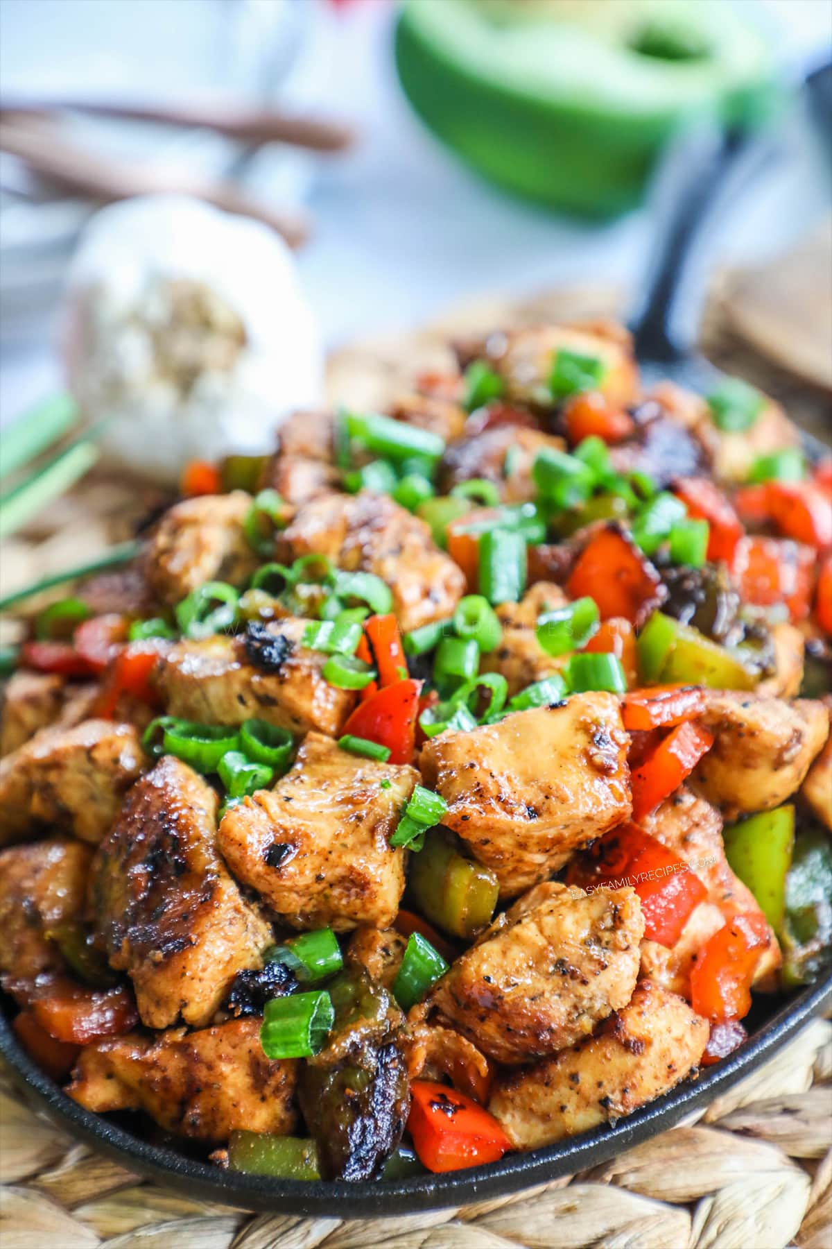 Cajun Chicken in skillet garnished with green onions