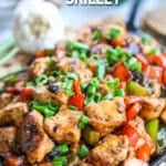 Cajun Chicken in skillet garnished with green onions