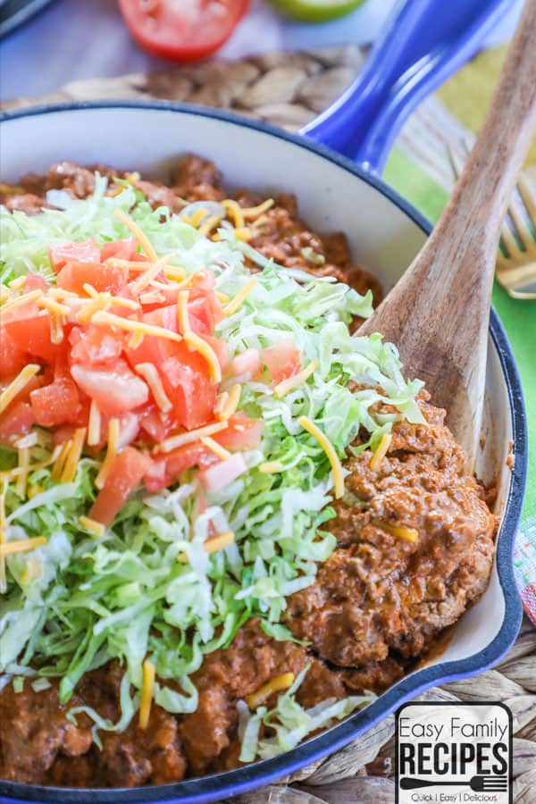 Easy Cheesy Taco Skillet topped with lettuce and tomatoes