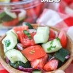 Classic cucumber tomato salad with red onions as a side dish