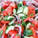 Classic cucumber tomato salad with red onions as a side dish