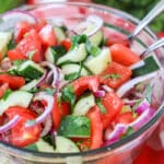 Classic cucumber tomato salad with red onions as a side dish