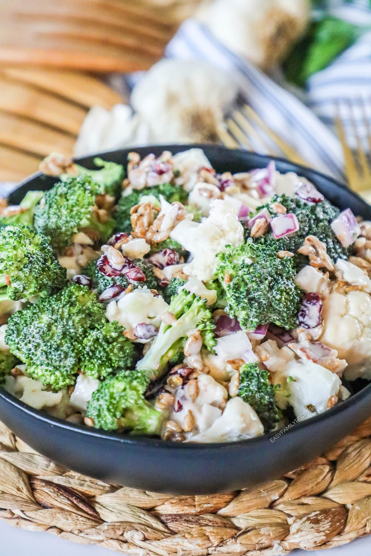 Broccoli cauliflower salad with bacon in serving bowl.