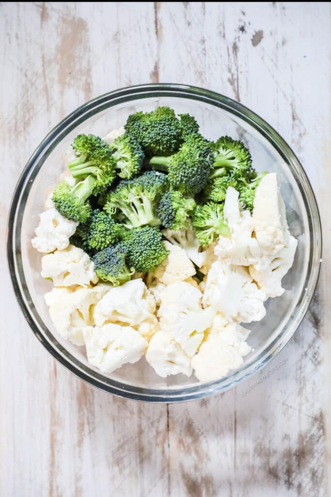 How to make Broccoli Cauliflower Salad step 1: Chop broccoli and cauliflower into small florets.