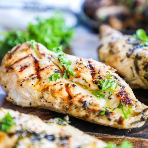Perfectly Grilled Chicken Breast garnished with parsley and Marinated in Apple Cider Vinegar to be tender and juicy