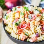 Rotini Salad with pepperoni, cheeses, and veggies in a bowl