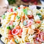 Rotini Salad with pepperoni, cheeses, and veggies in a bowl