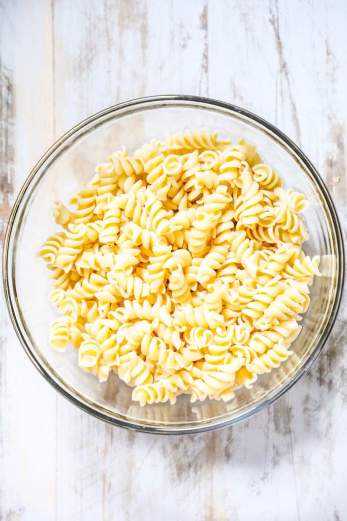Step by step recipe for Rotini Pasta Salad. Step 1: Cook pasta according to package directions. Drain, rinse under cold water, and transfer to a large bowl.