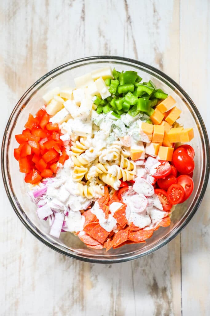 Step by step recipe for Rotini Pasta Salad. 3: Pour the dressing over the salad and toss to coat.