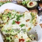 Lifting chicken breast with avocado topping from pan