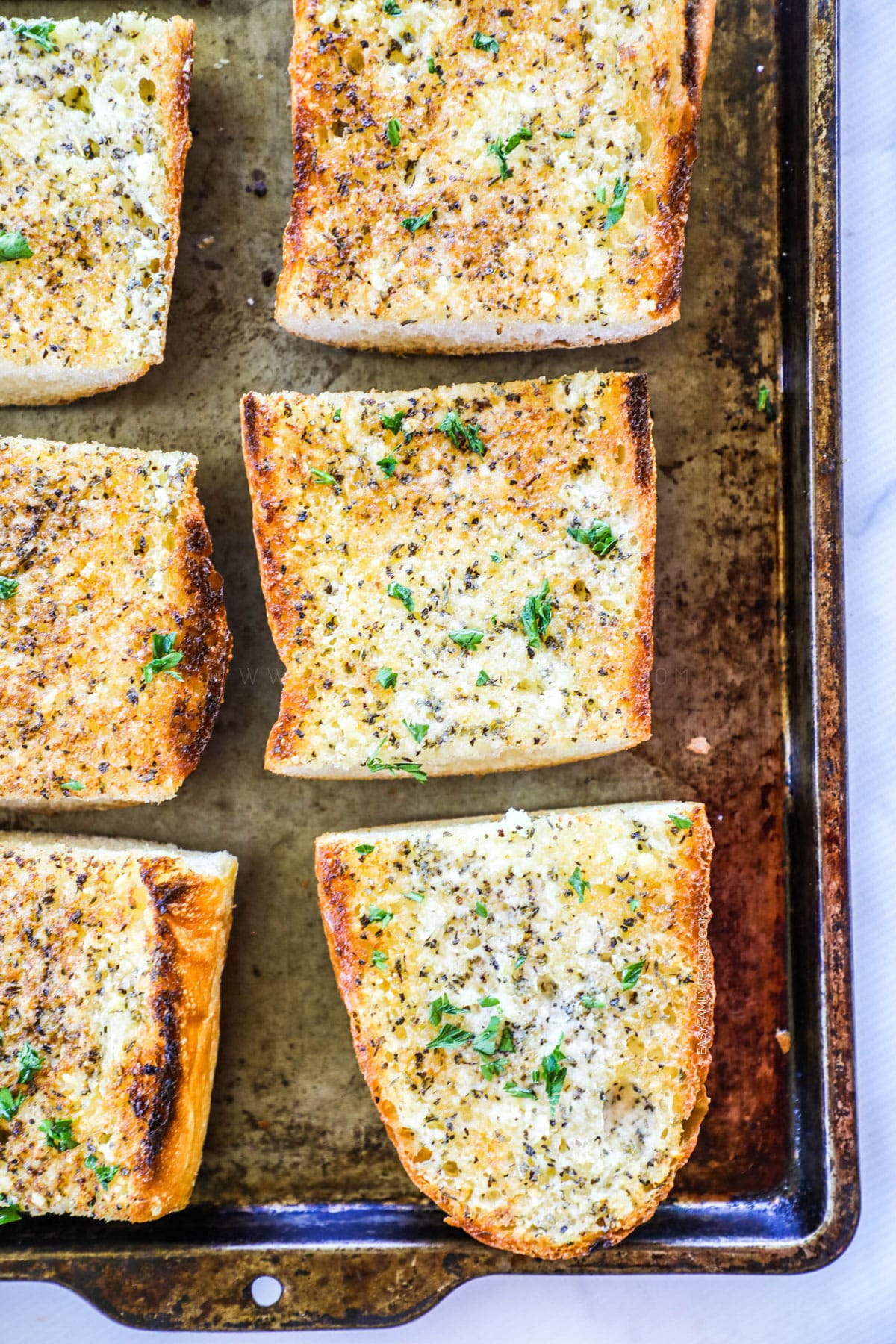Easy Garlic Bread on a baking sheet with toasty browned edges.