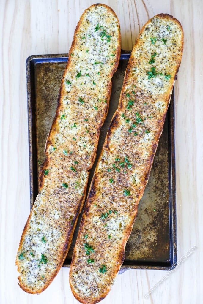 How to make Garlic Bread homemade - Step 4: Bake the garlic bread until garlic bread spread is melted and edges are golden brown