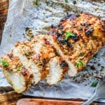 Tender and juicy Chicken prepared in Mexican Chicken Marinade, sliced on a cutting board