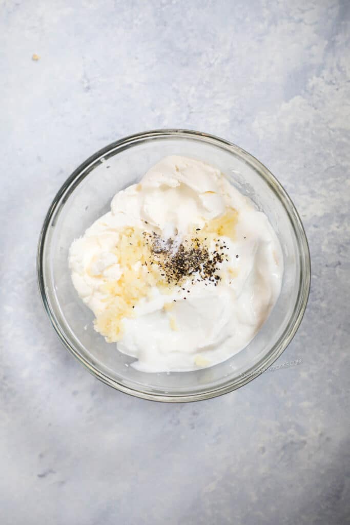 How to make Low Carb Creamy Garlic Parmesan Chicken Step 1- Combine cream cheese, sour cream, garlic, salt and pepper and mix til smooth.
