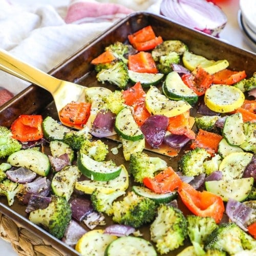 Vegetables roasted in the oven on a baking sheet for a dinner side dish