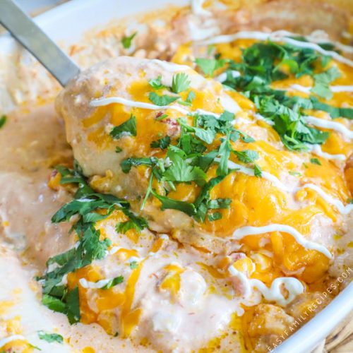 Spatula getting salsa chicken out of casserole dish