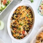 Southwest chicken with beans corn and cheese in a casserole dish