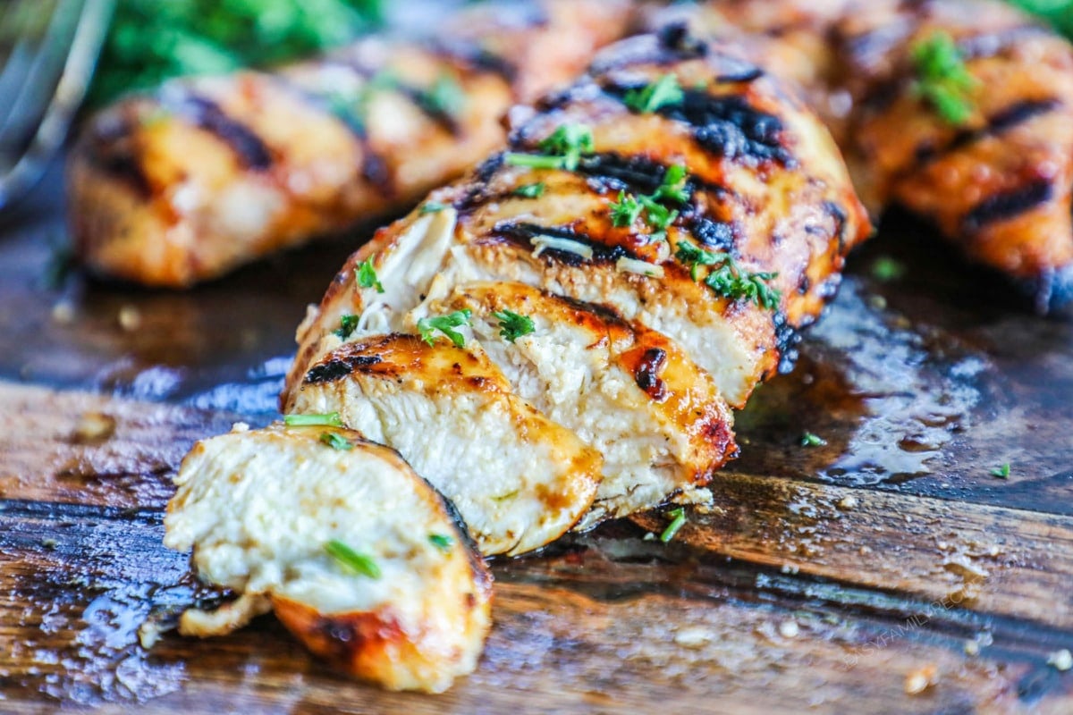 BBQ Marinated Chicken grilled and sliced to show how tender and juicy it is