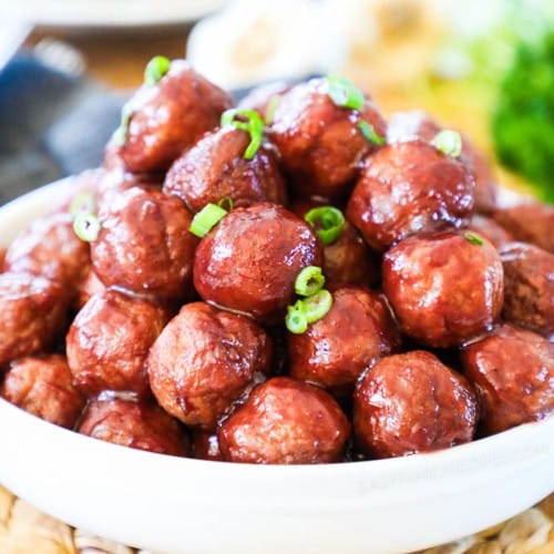 Grape Jelly meatballs made in crockpot put in a bowl to serve at a party