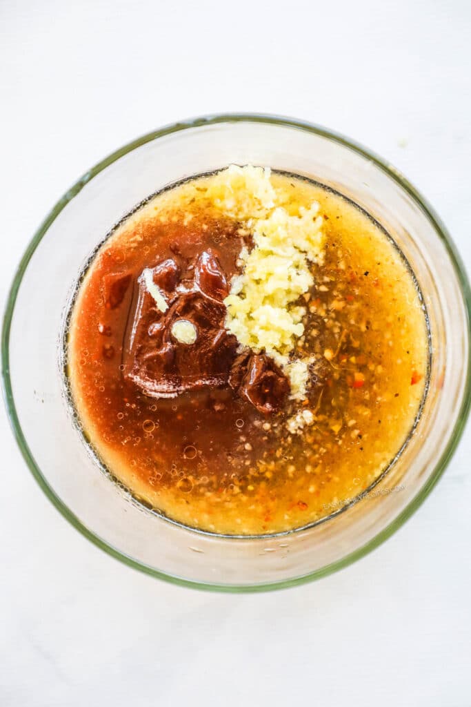 whisk together the BBQ sauce, Italian dressing, apple cider vinegar, and pressed garlic.