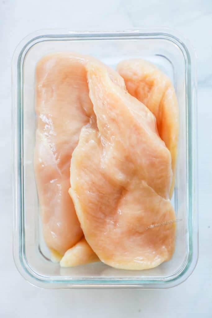 Poke chicken all over with a fork. Place the chicken in a dish or zip top bag