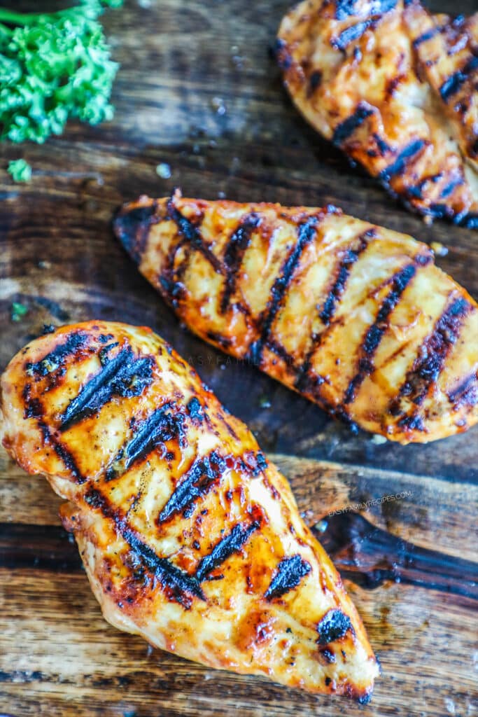 Heat the grill to medium heat and brush with oil to prevent sticking. Place chicken on the grill and cook for 4-6 minutes per side, depending on thickness.