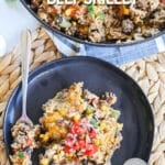 Mexican Style beef and rice skillet served on a plate topped with salsa.
