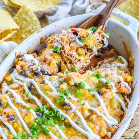 Mexican Chicken in Casserole dish drizzled with sour cream