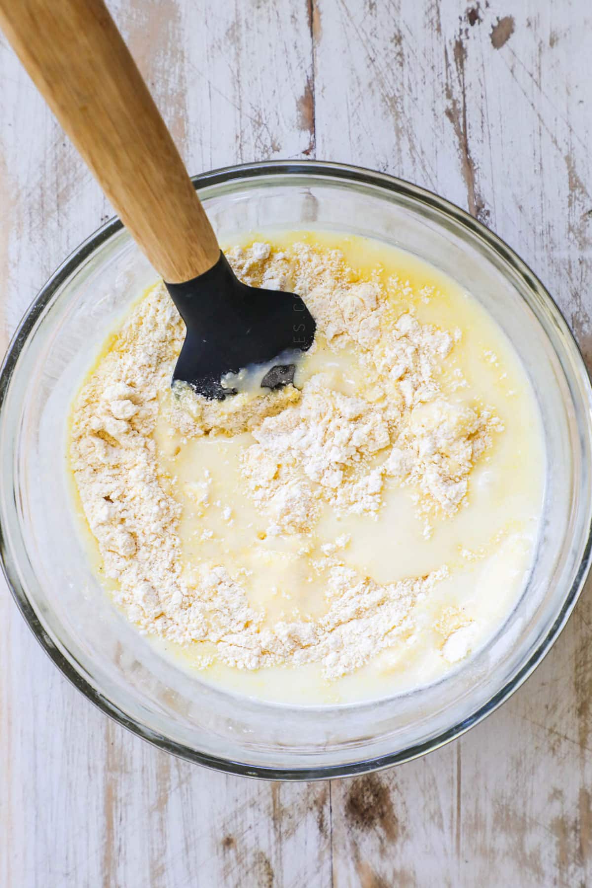 Buttermilk Cornbread Step 3: Add the wet ingredients into the dry ingredients and mix with a wooden spoon until just moistened.
